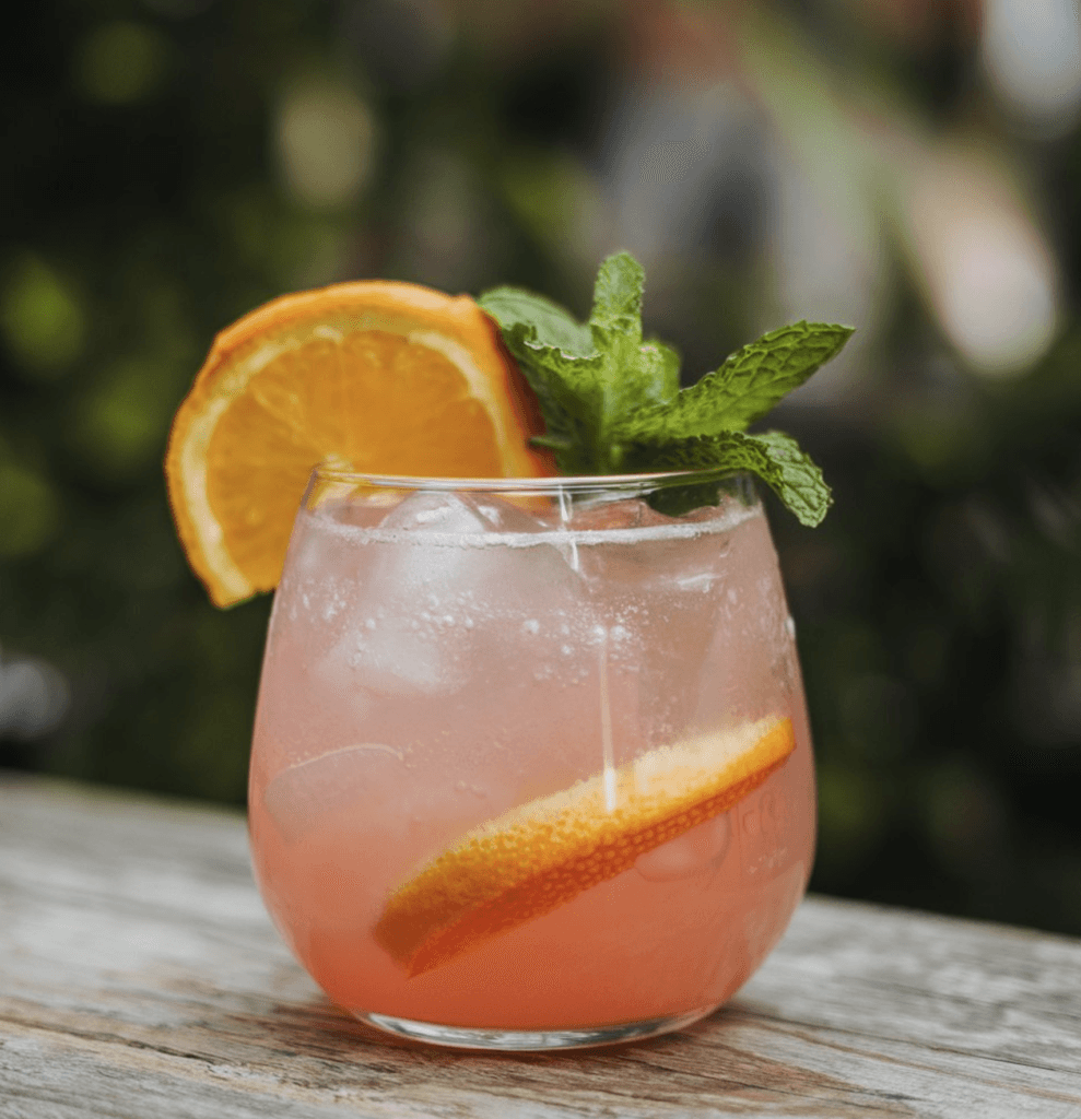 A cozy glass of sleepy girl mocktail garnished with lavender, perfect for bedtime relaxation.