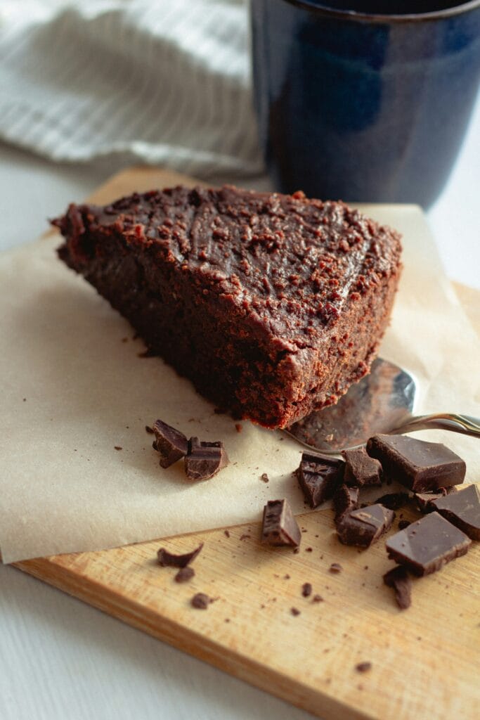 A beautifully frosted chocolate cake garnished with fresh strawberries, perfect for any occasion.