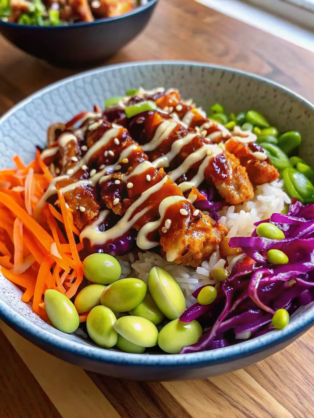 A collection of fresh, colorful ingredients for Teriyaki Chicken Bowls, including thinly sliced raw chicken breast, a bowl of homemade teriyaki sauce, shredded orange carrots, shelled green edamame, purple shredded cabbage, and thinly sliced cucumbers in a small dish, all artfully arranged on a wooden cutting board on a marble countertop. Soft morning light from an east window illuminates the scene, creating warm tones and gentle shadows. NO HANDS OR PEOPLE.