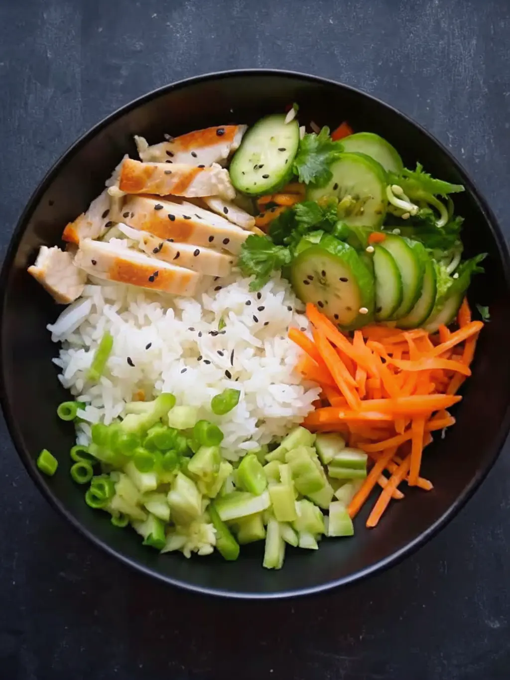 A non-stick skillet containing golden-brown, crispy pan-fried chicken pieces, glistening with a reddish-orange glaze, just removed from the heat. A ceramic spoon rests nearby, ready for saucing. The scene is captured with natural morning light on a marble countertop, with a wooden accent and blurred fresh herbs in the background. No hands or people. (3:4 ratio)
