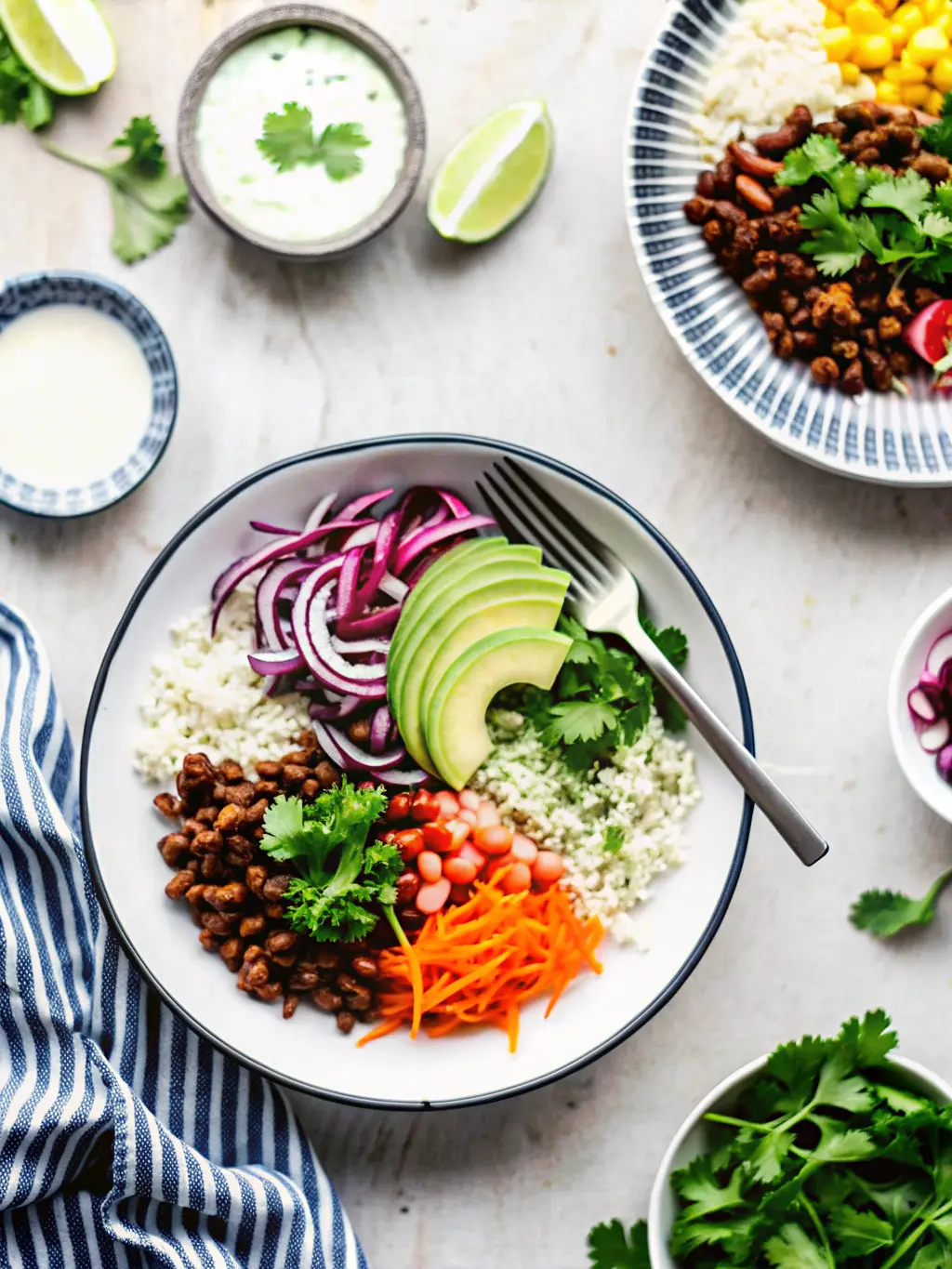 A close-up shot focusing on the simmering process of richly seasoned dark brown ground beef in a stainless steel skillet, with steam gently rising. The beef is mixed with a colorful blend of spices. The skillet rests on a stovetop, with a corner of a marble countertop visible. Fresh cilantro sprigs are visible in a ceramic vase in the blurred background. Natural morning light, soft shadows, warm tones, clean and tidy presentation. No hands or people.