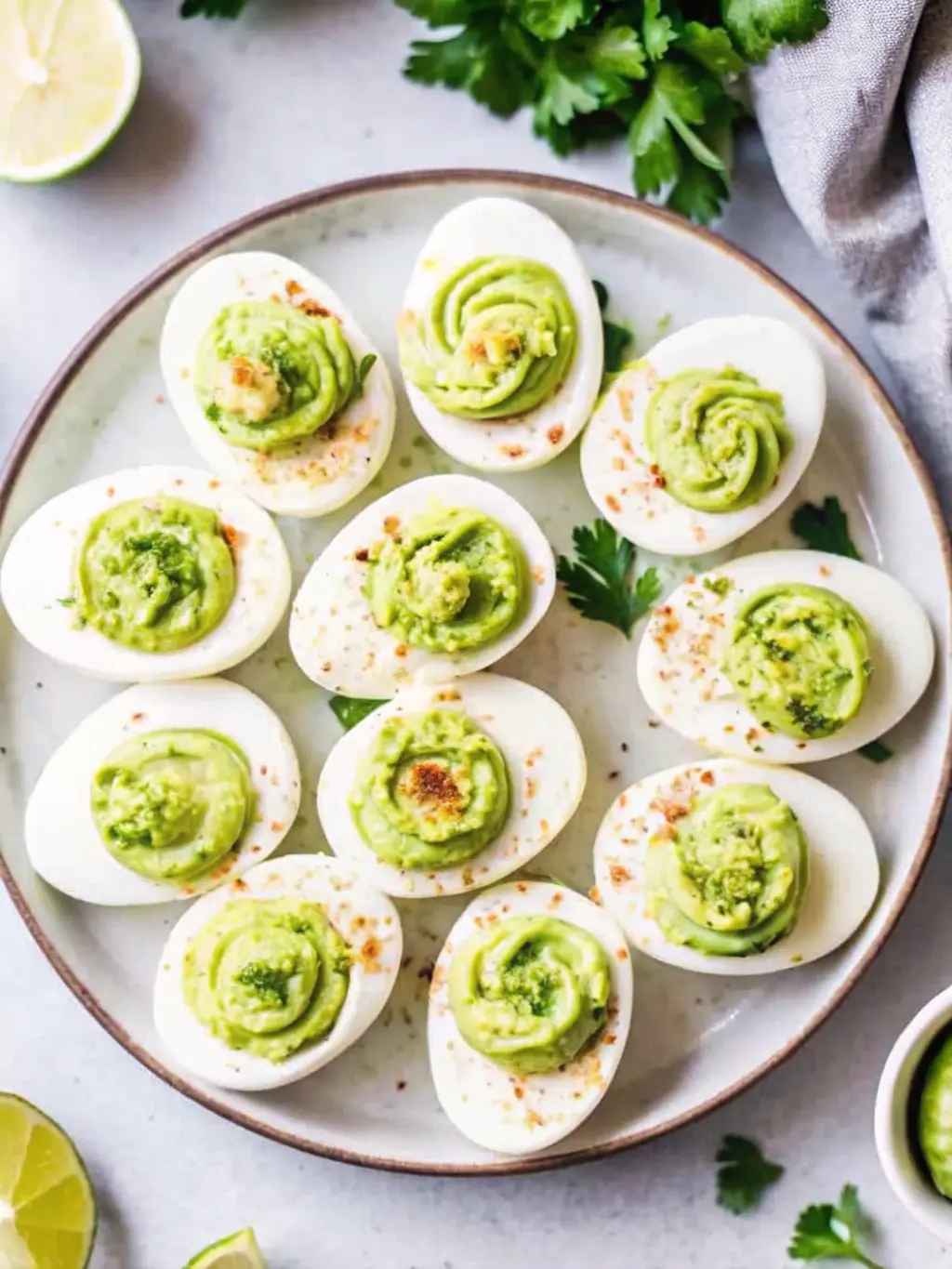 Overhead shot showcasing the ingredients for 'Million Dollar Deviled Eggs' on a wooden cutting board. Hard-boiled egg halves are neatly arranged, with a ceramic bowl containing scooped-out yolks. Alongside are small minimalist white ceramic bowls holding mayonnaise, Dijon mustard, apple cider vinegar, salt, black pepper, and fresh chives. A small ceramic bowl of paprika and a salt cellar are also visible. Bathed in natural morning light from an east window on a marble countertop, with fresh herbs in a ceramic pot slightly blurred in the background. Soft shadows, warm tones, clean and tidy presentation. 3:4 ratio. NO HANDS OR PEOPLE.